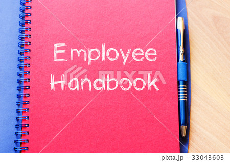 Employee handbook text concept on notebook Employee handbook text concept on notebook 33043603