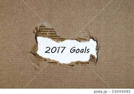 The word 2017 goals appearing behind torn paper 33044095