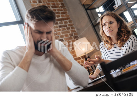 Unhappy young woman being mad at her boyfriend Unhappy young woman being mad at her boyfriend 33045309