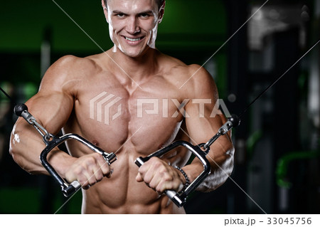 Muscular handsome athletic bodybuilder fitness model posing afte Muscular handsome athletic bodybuilder fitness model posing afte 33045756