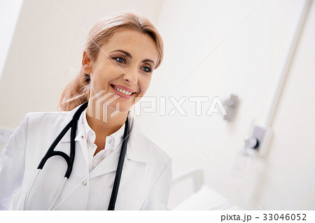 Excellent dedicated doctor enjoying her day at Excellent dedicated doctor enjoying her day at 33046052