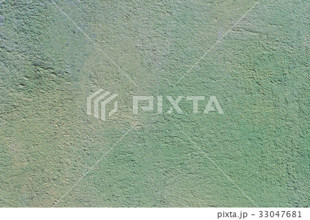 Emerald green painted stucco wall.  33047681