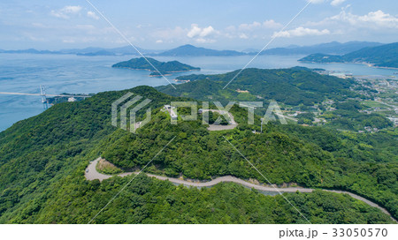 亀老山と来島海峡大橋 愛媛県今治市大島 しまなみ海道 空撮の写真素材