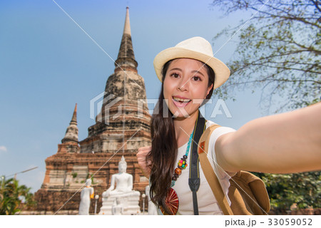 Happy tourist taking smartphone picture 33059052