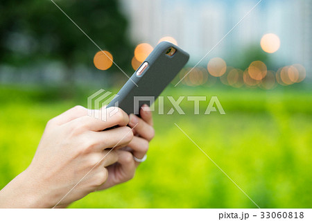 Woman use of mobile phone at outdoor Woman use of mobile phone at outdoor 33060818