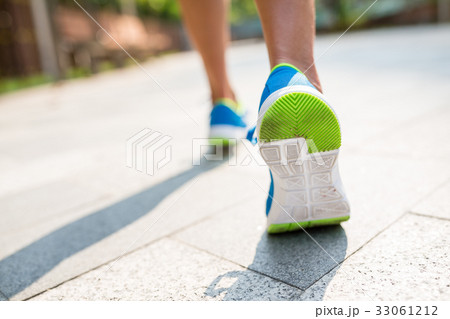 Woman run in a city Woman run in a city 33061212