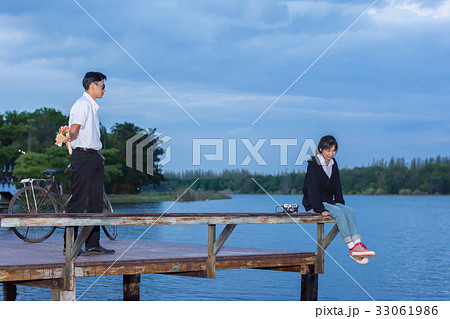 bouquet of flowers in the hands man hidden behind. bouquet of flowers in the hands man hidden behind. 33061986