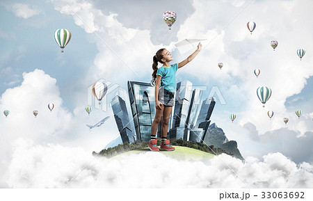 Concept of careless happy childhood with girl dreaming about fut 33063692