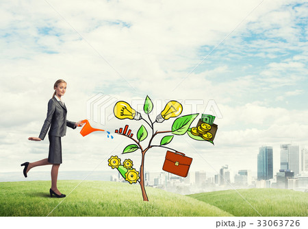 Young businesswoman outdoors watering drawn growth concept with can 33063726