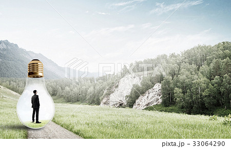 Businessman inside light bulb 33064290