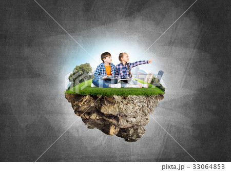 Two kids of school age with book exploring this great world Two kids of school age with book exploring this great world 33064853