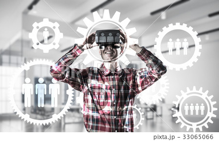 Guy wearing checked shirt and virtual mask demonstrating some em 33065066