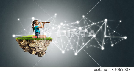Concept of careless happy childhood with girl looking in spyglass 33065083