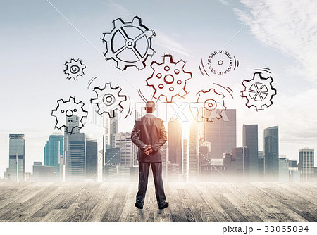 Cogwheel engine drawn on screen as symbol for teamwork and coope Cogwheel engine drawn on screen as symbol for teamwork and coope 33065094