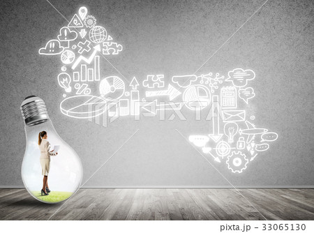 Businesswoman trapped in bulb 33065130