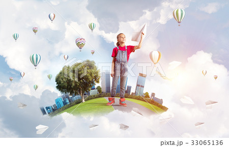 Concept of careless happy childhood with girl dreaming about future 33065136