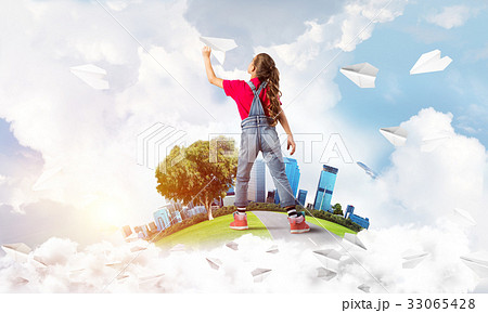 Concept of careless happy childhood with girl dreaming about future 33065428