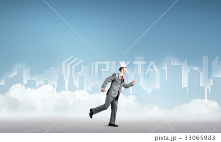 King businessman in elegant suit running and blue cityscape silhouette at background King businessman in elegant suit running and blue cityscape silhouette at background 33065983
