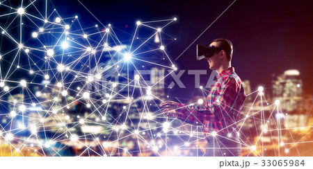 Guy wearing checked shirt and virtual mask reaching hand to feel 33065984