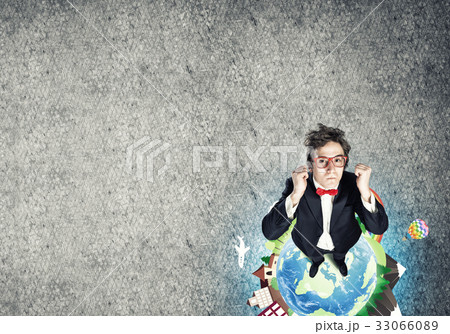 Businessman on Earth globe 33066089