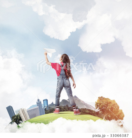 Concept of careless happy childhood with girl dreaming about fut 33066387
