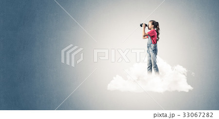 Concept of careless happy childhood with girl dreaming about fut 33067282