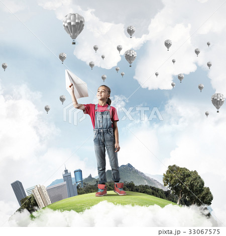 Concept of careless happy childhood with girl dreaming about fut Concept of careless happy childhood with girl dreaming about fut 33067575