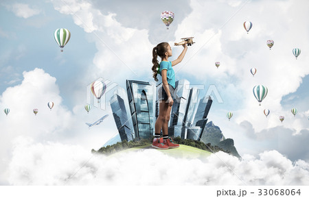 Concept of careless happy childhood with girl dreaming to become Concept of careless happy childhood with girl dreaming to become 33068064
