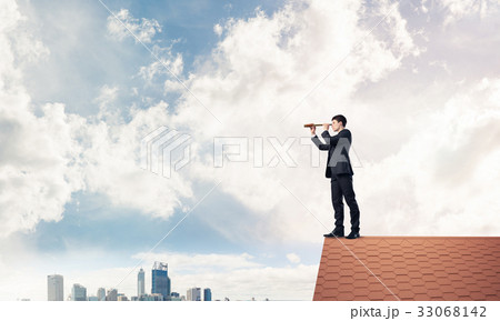 Mister boss on brick roof in search of something new. Mixed medi 33068142