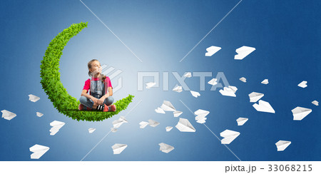 Concept of careless happy childhood with girl on green moon 33068215