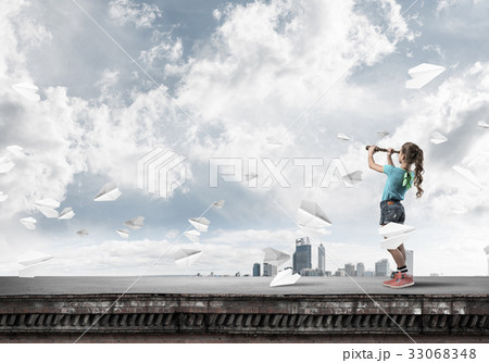 Concept of careless happy childhood with girl exploring this wor Concept of careless happy childhood with girl exploring this wor 33068348