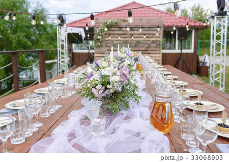 Glasses on the festive table setting. Wedding Glasses on the festive table setting. Wedding 33068903