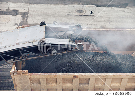 Road works. Asphalt removing machine loading 33068906