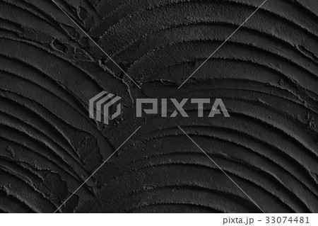 Decorative black structural plaster on wall 33074481