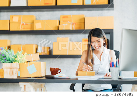 Asian small business owner working at home office Asian small business owner working at home office 33074995
