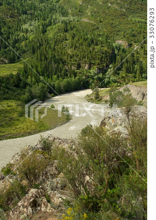 Beautiful sunny valley between mountains with lush 33076293