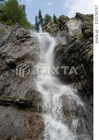 High waterfall in the mountains 33076297