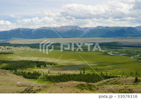 Beautiful sunny valley between mountains with lush 33076316