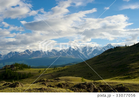 Beautiful sunny valley between mountains with lush 33077056