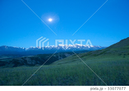 Beautiful sunny valley between mountains with lush 33077077
