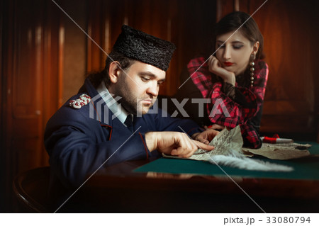 Man in retro clothing shaped reading manuscript. 33080794