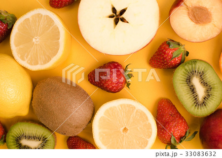Set of fruits in a cut on a yellow background 33083632