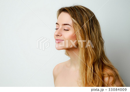 Smiling Blonde Woman Profile Portrait 33084009