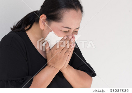 sick woman with cold or flu sneezing sick woman with cold or flu sneezing 33087386