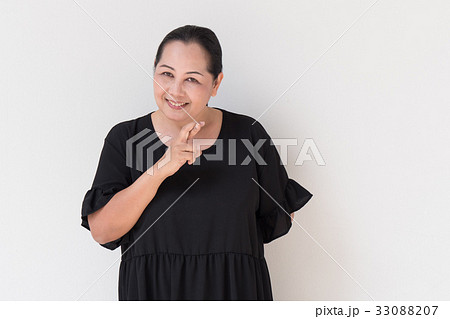 middle age woman crossing her finger, wishing middle age woman crossing her finger, wishing 33088207