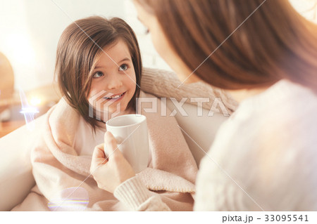 Beautiful kid listening attentively her mom Beautiful kid listening attentively her mom 33095541