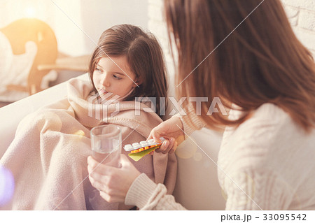Upset girl pressing lips while looking aside 33095542