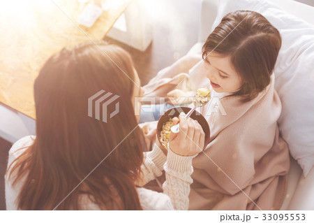 Top view picture of young mother that feeding her 33095553