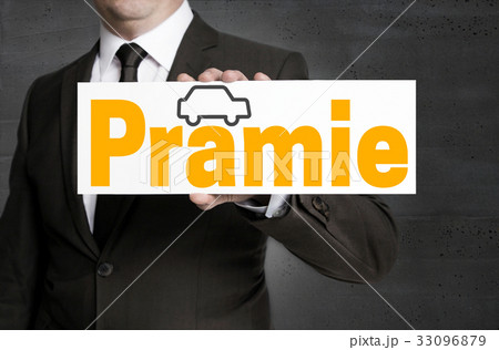 Praemie (in german bonus) with car sign is held by businessman 33096879