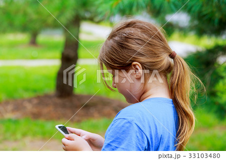 Beautiful girl playing on the phone Beautiful girl playing on the phone 33103480